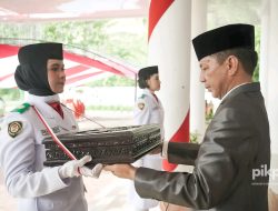 Siap Dikibarkan Esok, Bupati Jusnan Mokoginta Pimpin Upacara Pemindahan Duplikat Bendera Pusaka Merah Putih