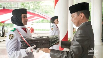 Siap Dikibarkan Esok, Bupati Jusnan Mokoginta Pimpin Upacara Pemindahan Duplikat Bendera Pusaka Merah Putih